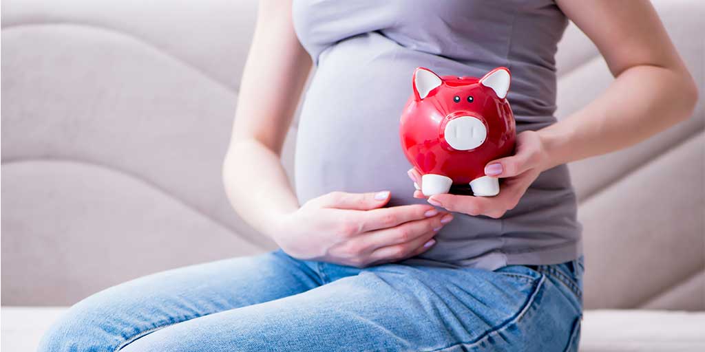 pregnant woman with moneybox